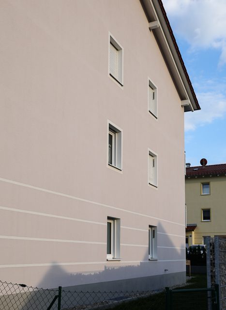 Multi-family housing estate with soffit ventilators