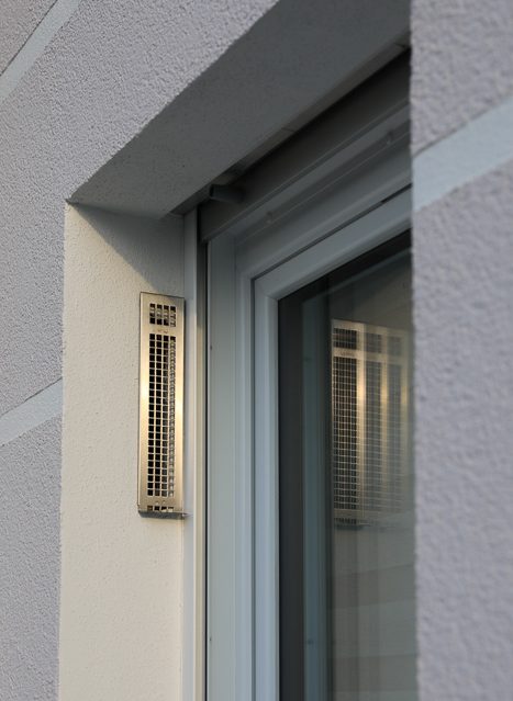 Multi-family housing estate with soffit ventilators