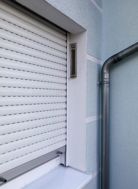 Multi-family housing estate with soffit ventilators