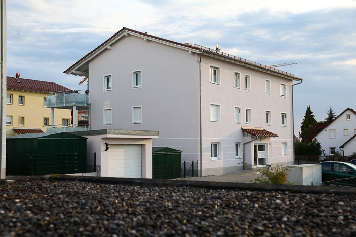 Multi-family housing estate with soffit ventilators