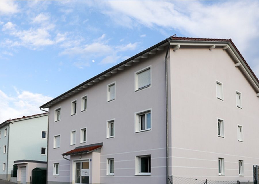 Multi-family housing estate with soffit ventilators