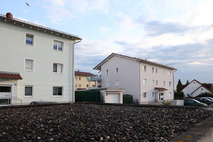 Multi-family housing estate with soffit ventilators